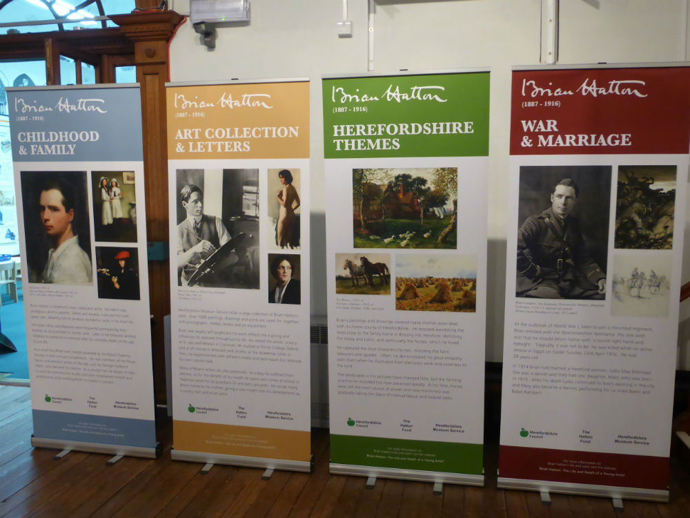Display boards advertising an exhibition of paintings by artist Brian Hatton at the museum in Broad Street